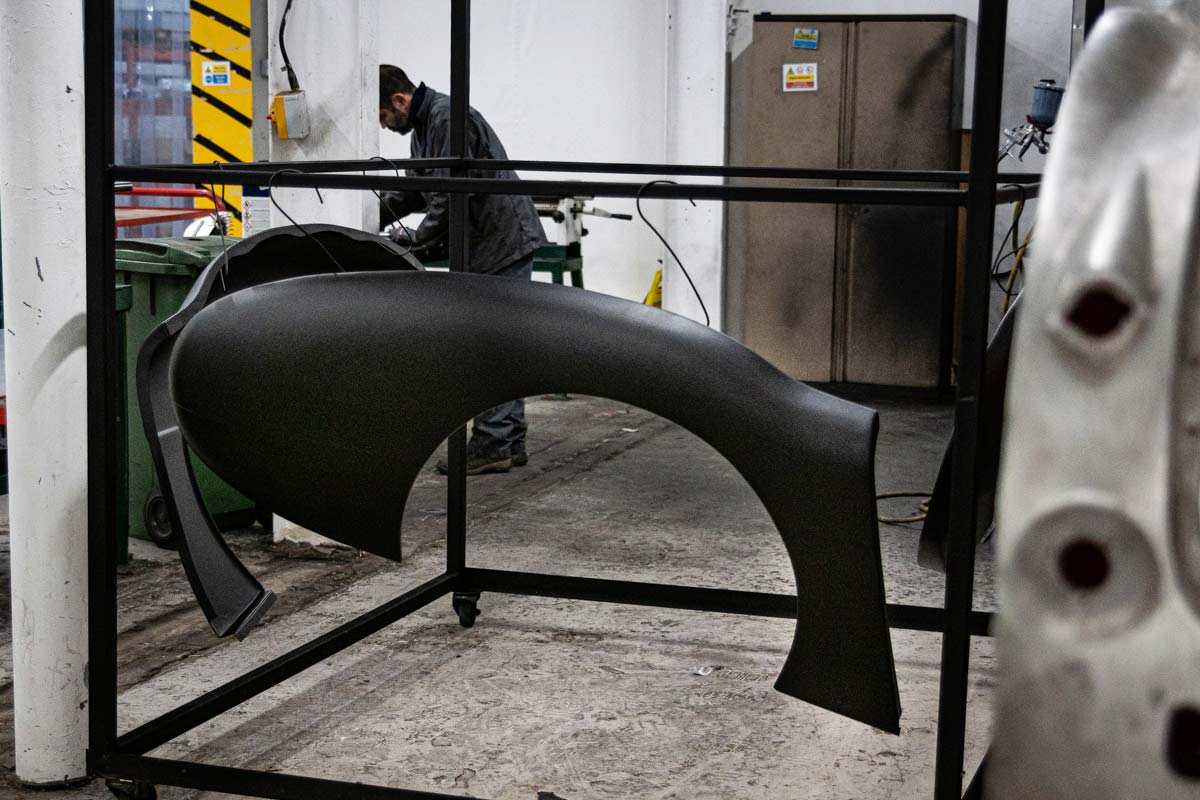 Steel Austin Healey rear wing drying after painting.