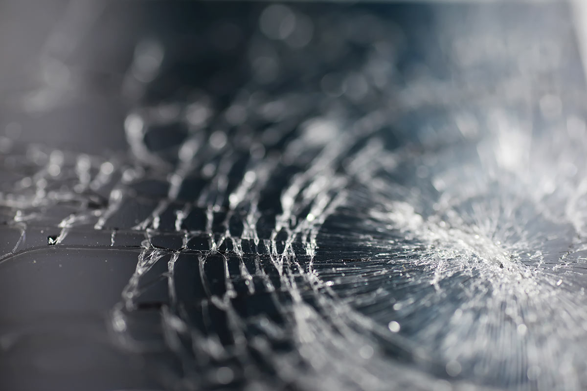 Close up of shattered windscreen glass.