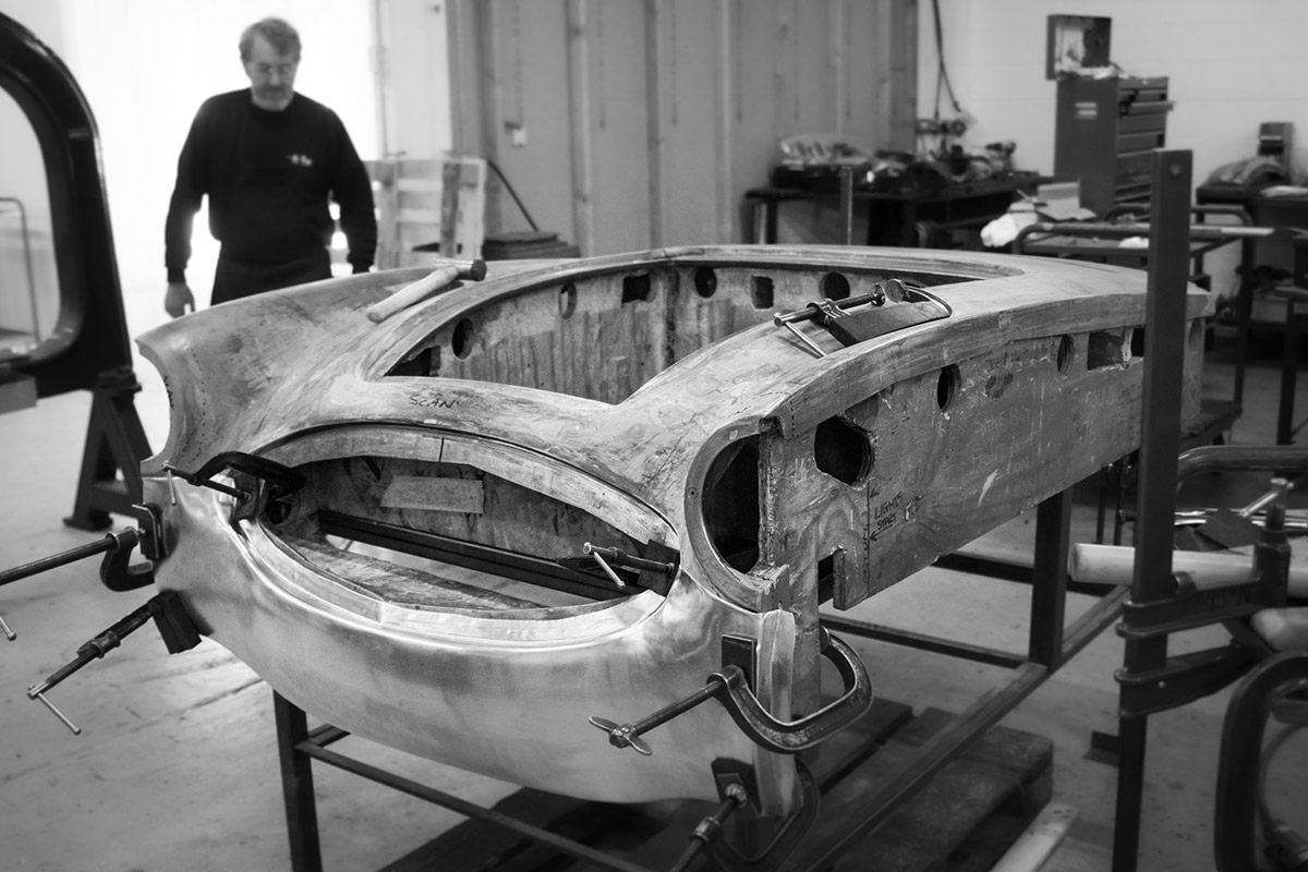 Mark Styles jig chasing aluminium Austin Healey panel at A H Panels.