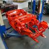 Freshly painted Austin Healey 3000 BJ8 chassis in bright red at JME Healeys rest