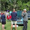 Rebecca Kemsley and John Lee speaking with an Austin Healey club member at Concl
