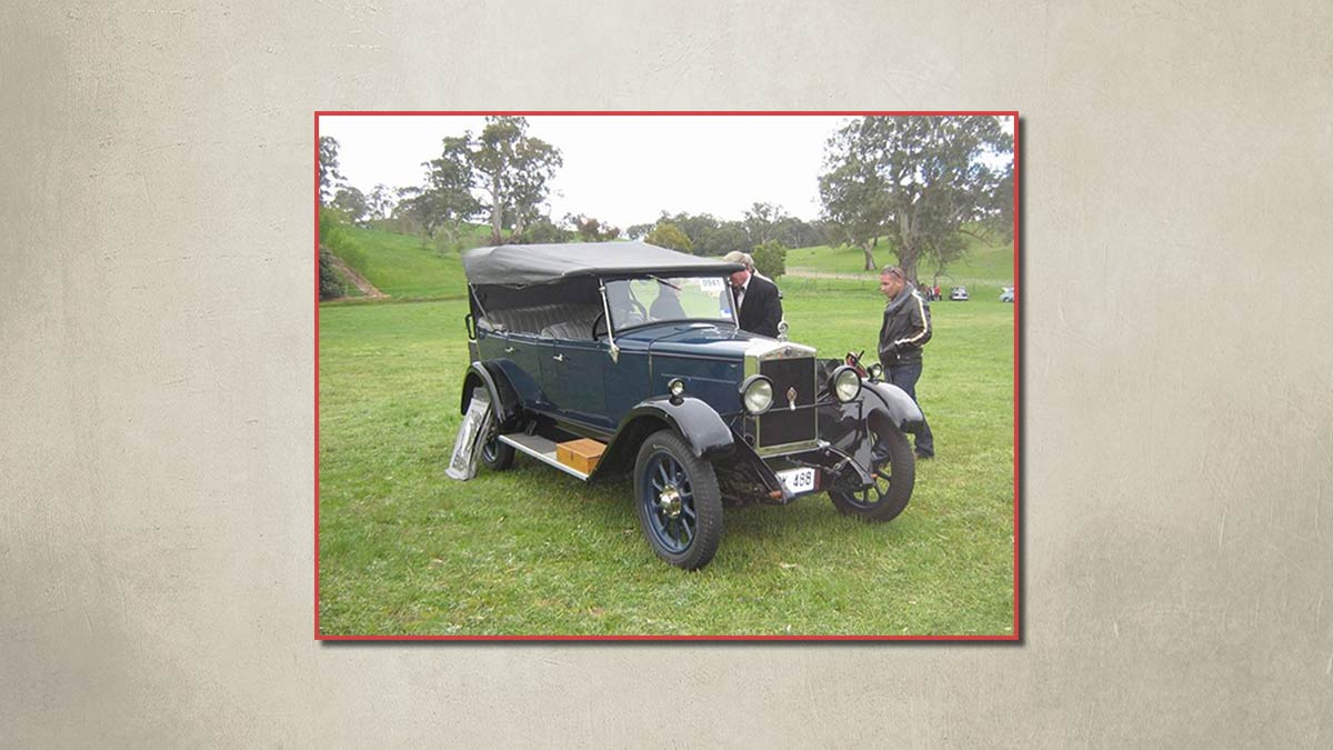 1923 Overland vintage car parked on grass.