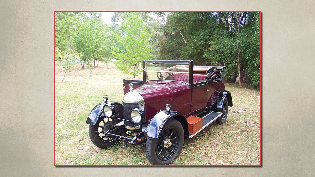 Open top burgandy 1928 Bullose Oxford vintage car.