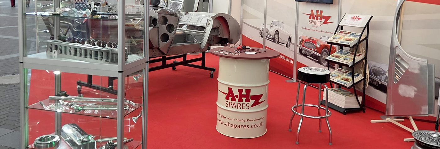 A H Spares exhibition stand at Retro Classics Essen 2026 with Austin Healey parts and catalogues on display.