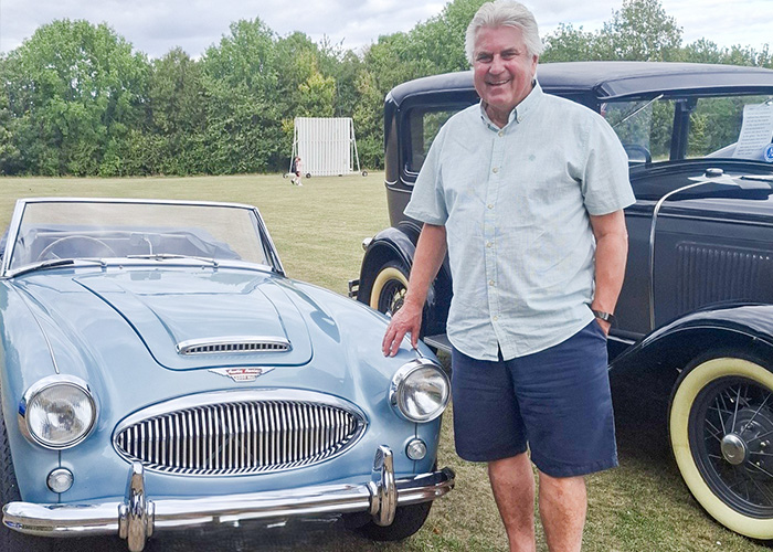 Paul Stanforth with his Austin Healey BJ7 in Healey Blue at Southam Classic Car and Bike Show, celebrating his 50-year dream.