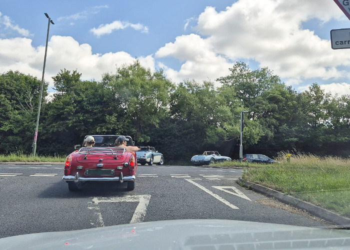 Convoy of Healeys at a junction