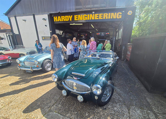 Green Austin Healey 3000 prominent outside Hardy Engineering on Ladies Drive It Day 2025