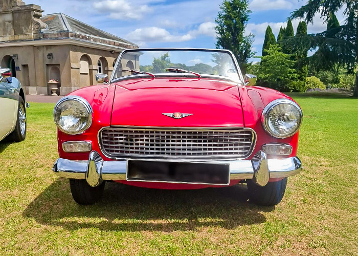 Red Austin Healey Sprite at the Royal Automobile Club in Epsom