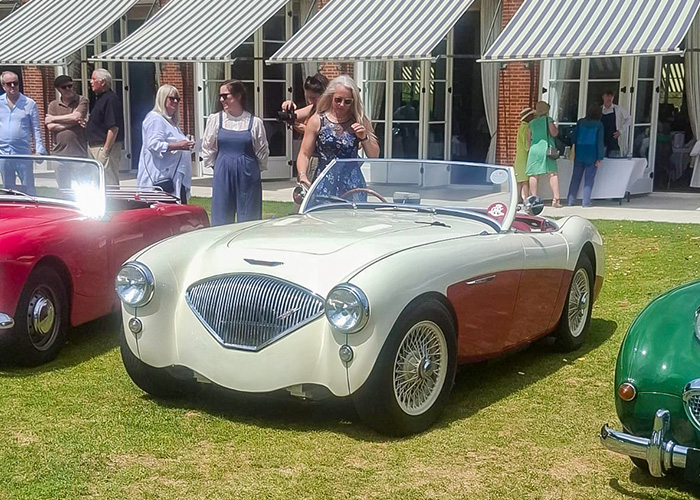 White and red Austin Healey 100M at the Royal Automobile Club in Epsom