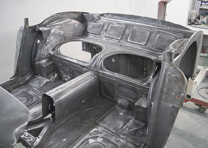 Interior rear seat section of Austin Healey 3000 MKIII BJ8 stripped and prepared for restoration.