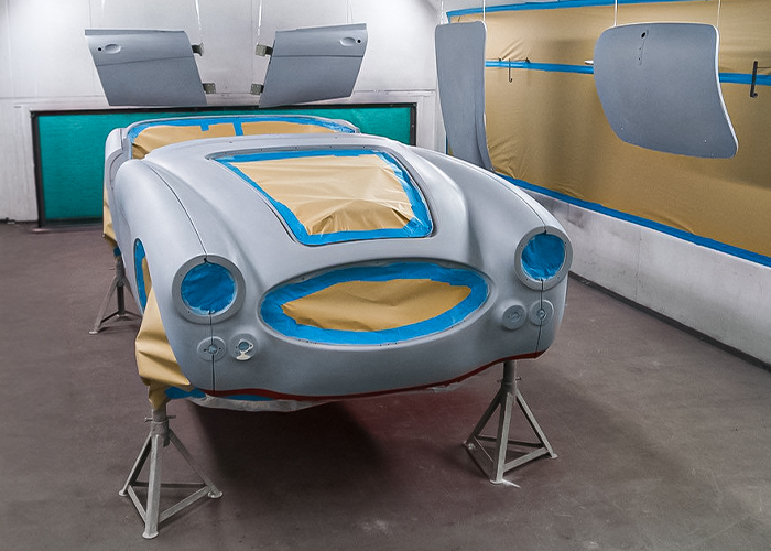 Austin-Healey BJ8 boot lid and door panels prepared for paint in the spray booth at JME Healeys