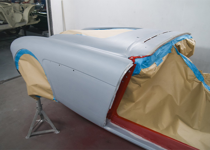 Austin-Healey BJ8 body shell masked and prepared for paint before colour application at JME Healeys