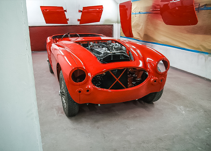 Fresh colour applied to Bob Hill’s Austin-Healey BJ8 body shell during restoration at JME Healeys