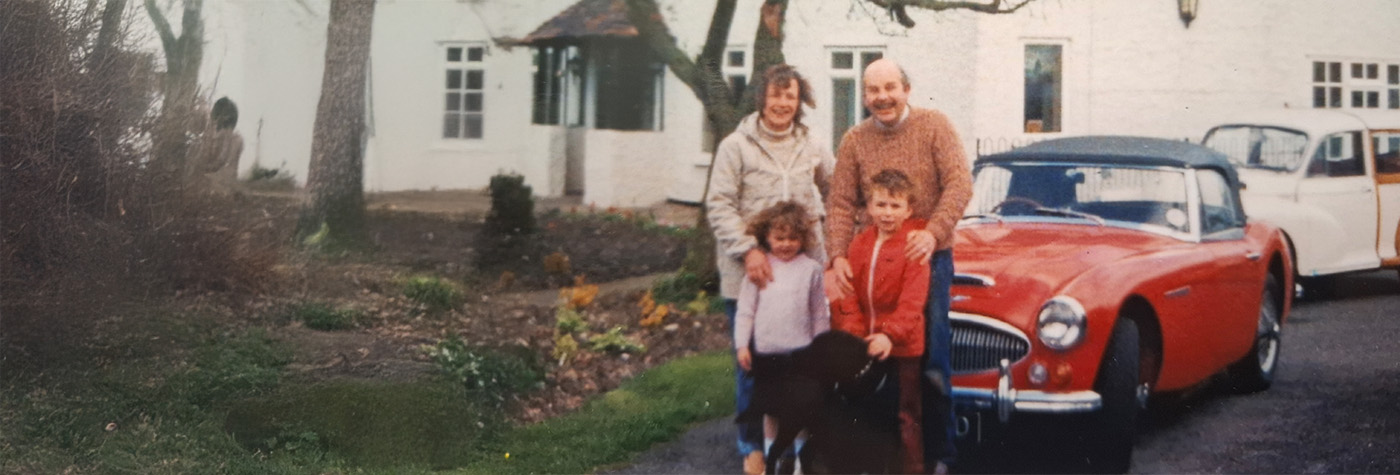 Hill family in the 1980s with their red Austin Healey 3000 BJ8 registration HMO 991D.