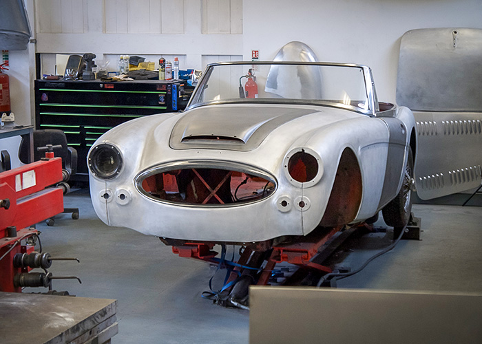 Austin Healey 3000 BJ8 body shell stripped to bare aluminium panels during restoration at JME Healeys.