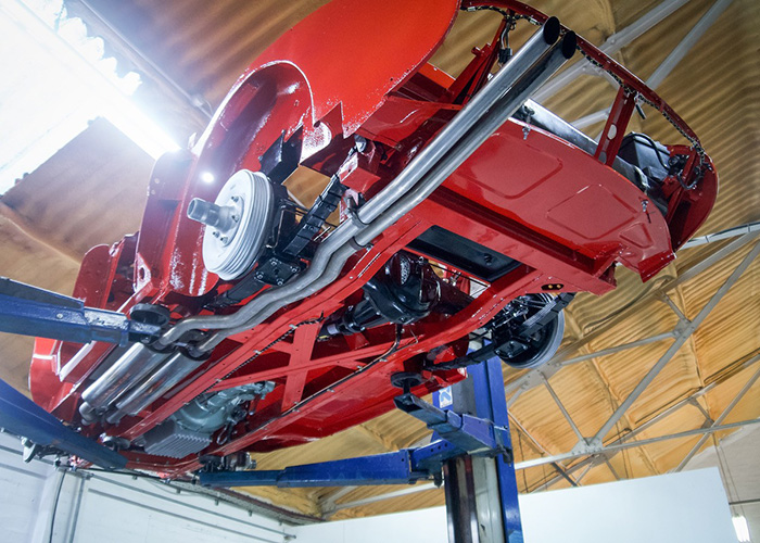 Underside rear structure and chassis of Austin Healey BJ8 during rebuild at JME Healeys