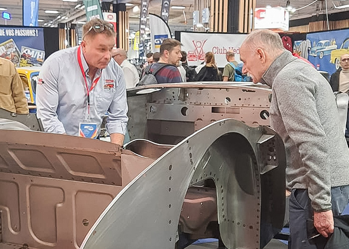 John Lee explaining the Austin Healey BT7 inner bodyshell assembly to a visitor at Rétromobile 2026.