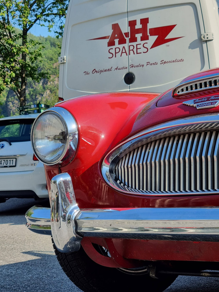 Red Austin Healey next to A H Spares' van