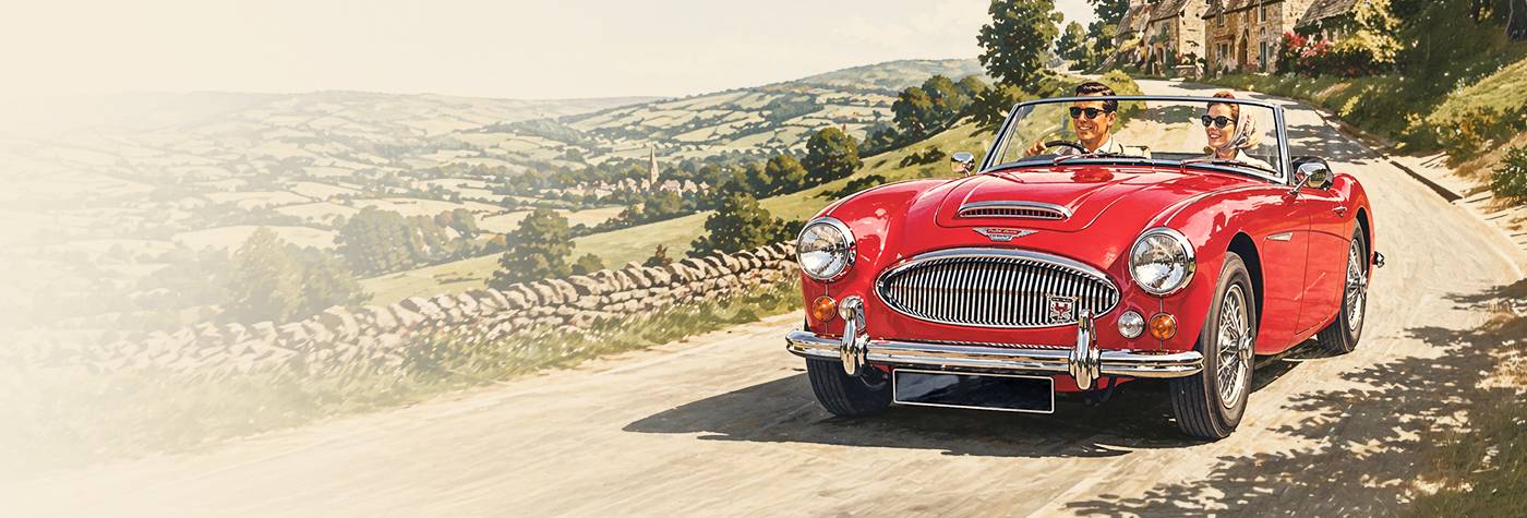 Austin Healey 3000 driving through English countryside on sunny Bank Holiday with scenic valley views