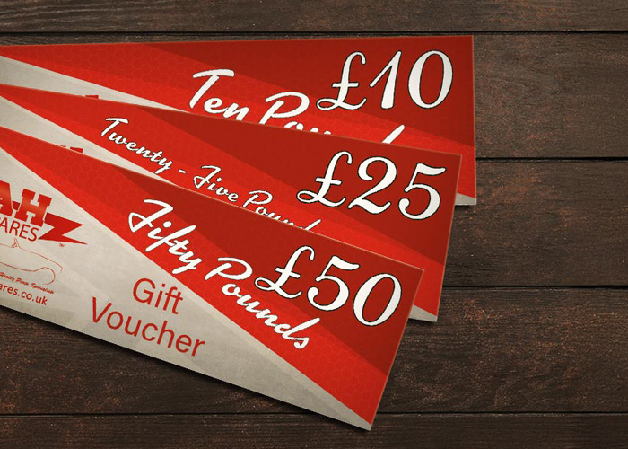 A H Spares gift vouchers on a wooden table