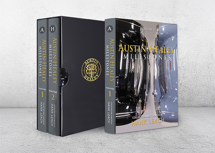 Austin Healey Milestones two-volume book set by Hank Leach with slipcase, featuring Healey grille cover artwork.