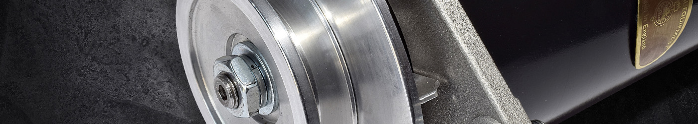 Close-up banner image of a Lucas Classic Dynalite alternator, focusing on the polished aluminium pulley, securing nut and black housing against a dark textured background.
