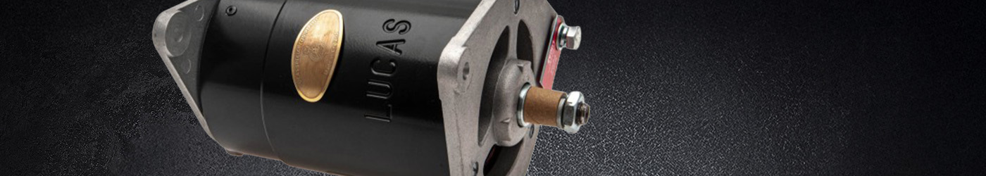 Close-up banner image of a Lucas Classic Sprite Dynalite, featuring the embossed Lucas branding, brass ID plaque, and cast aluminium mounting flange against a dark textured background.