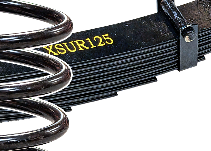 Close up of a front coil spring and rear quarter leaf spring
