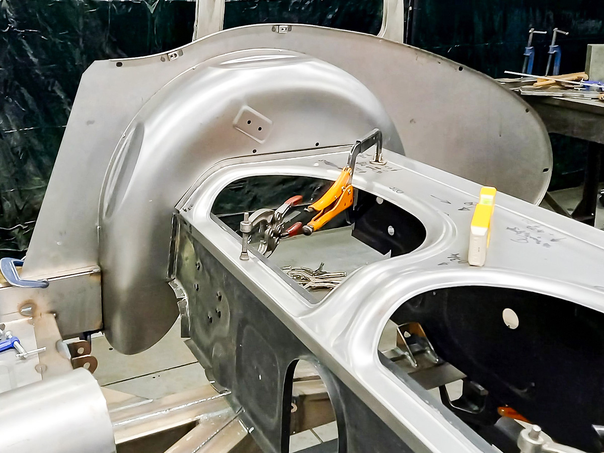 Right side Austin Healey rear inner wing and wheel arch attached to chassis and rear seat surround