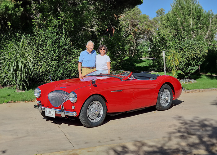 Roger and Lilly Moment standing next to Roger's Austin Healey BN1