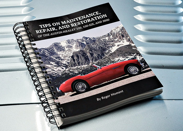 Roger Moment's book on the hood of an Austin Healey