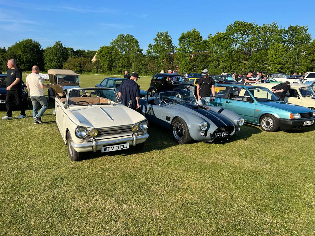Visitors admiring classic cars
