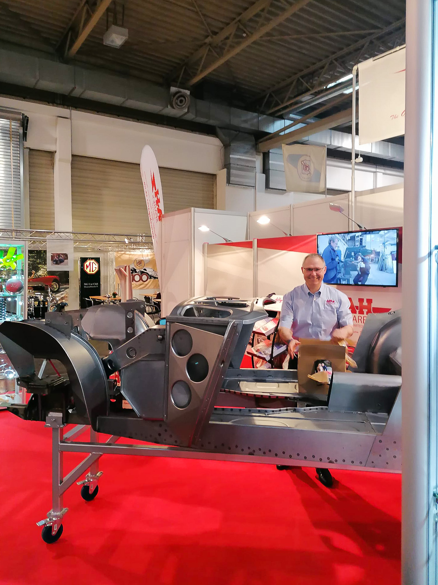 Paul Askew adding the finishing touches to A H Spares exhibition in Hall 2 Stand 257 at the Techno Classica Essen 2023 event