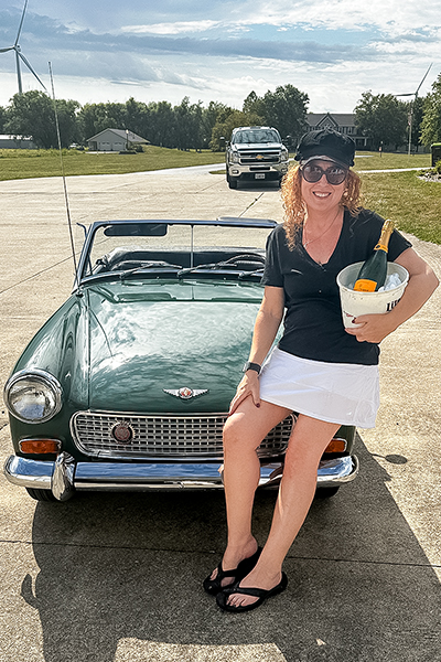 Cari Kalapis with her restored Austin Healey Sprite after driving it for the first time in late August 2025
