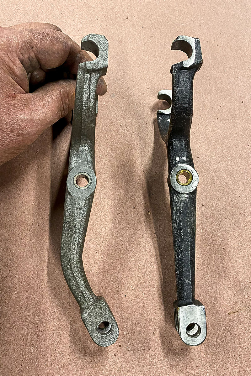 Bent clutch fork from Cari Kalapis' Austin Healey Sprite beside a straight replacement clutch fork