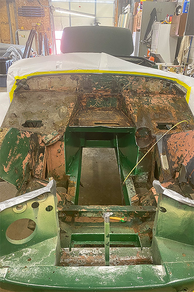 Stripped engine bay of Cari Kalapis' Austin Healey Sprite after cleaning in April 2022