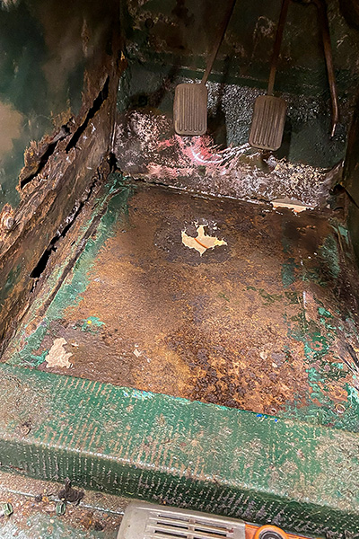 Rust damage being assessed in the floor of Cari Kalapis' 1969 Austin Healey Sprite MkIV