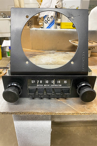 Original BMC radio from Cari Kalapis' Austin Healey Sprite after cleaning and repainting its bracket