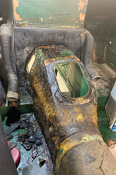 Old horsehair insulation being removed from the interior of Cari Kalapis' Austin Healey Sprite
