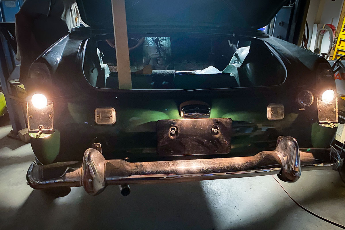 Headlamps illuminated on Cari Kalapis' 1969 Austin Healey Sprite for the first time during restoration in August 2022