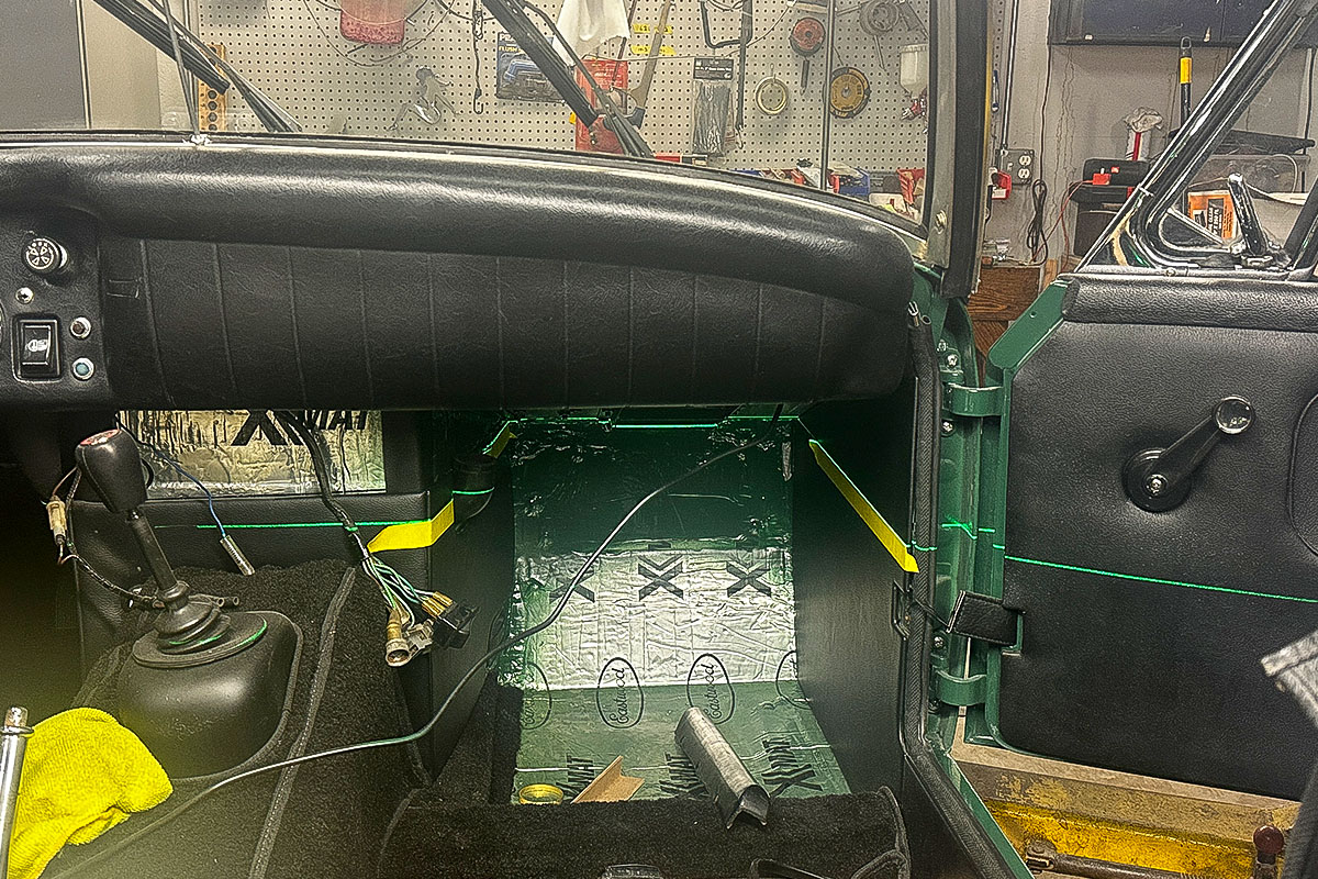 Laser being used to position the newly manufactured parcel shelf in Cari Kalapis' Austin Healey Sprite