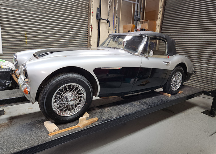 Austin Healey 3000 mounted on car lift