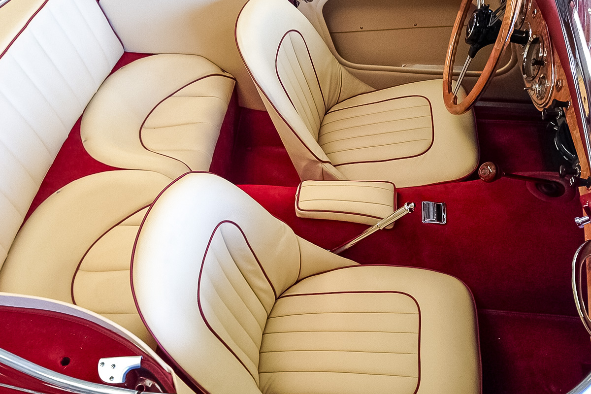 Completed magnolia interior with dark red piping and carpet in Pete Davies' Austin Healey 3000