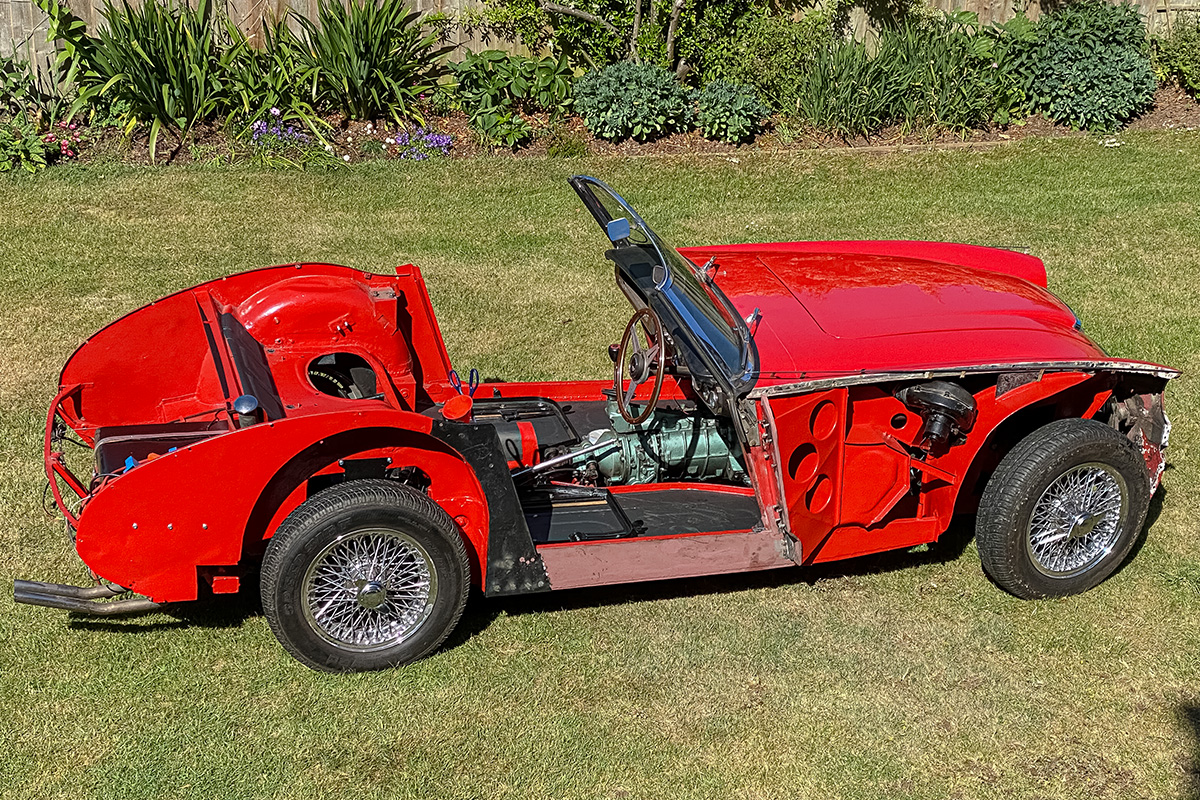 Austin Healey 3000 body shell in red primer during restoration