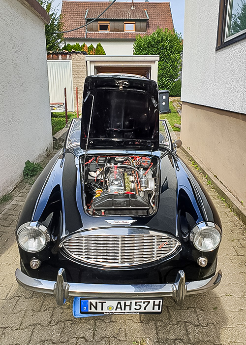 Front view of restored Austin Healey 100/6 with bonnet open
