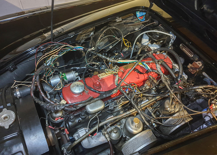 Austin Healey 100/6 engine bay with aged wiring before restoration